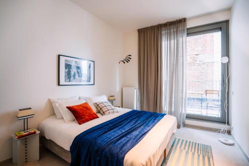 Кровать или кровати в номере Smartflats - River View Ghent