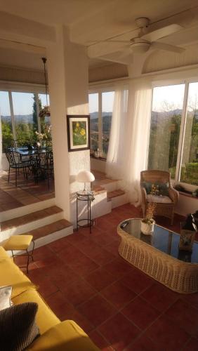 a living room with a couch and a table at Mijas Pueblo paradise villa in Málaga
