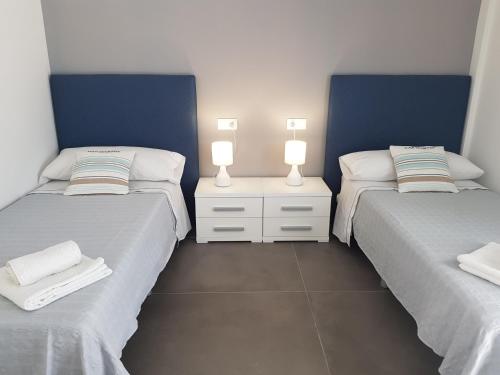 Un pat sau paturi într-o cameră la Preciosa casa en Alcossebre