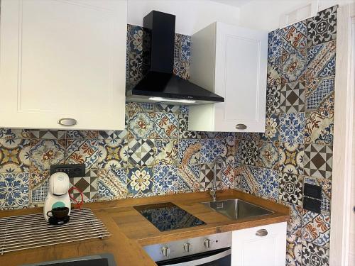 Køkken eller tekøkken på Chiarilù Casa Vacanze