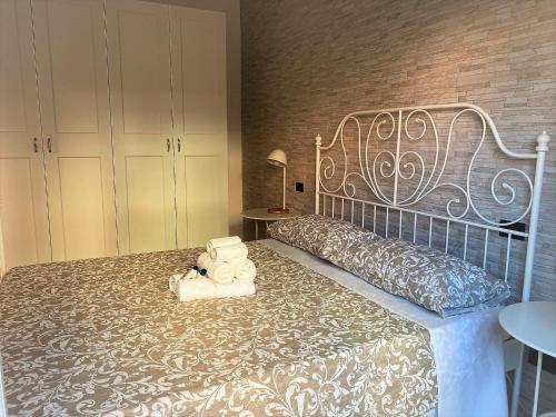 En eller flere senge i et værelse på Chiarilù Casa Vacanze