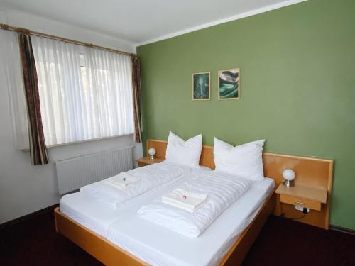 Voodi või voodid majutusasutuse Waldrestaurant & Hotel toas