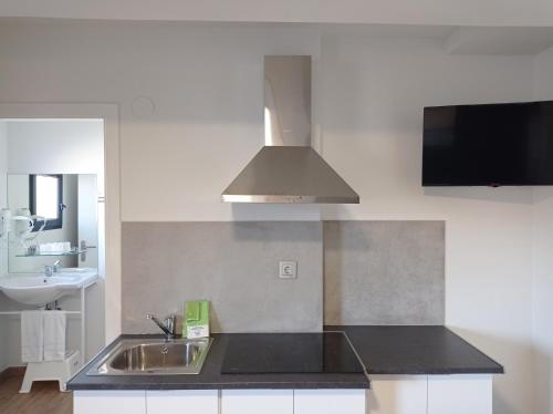 Kuchyňa alebo kuchynka v ubytovaní Apartamentos Hi Apartaments Santander 3000