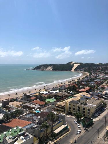 an aerial view of a city and the beach at FLAT NATAL PLAZA in Natal