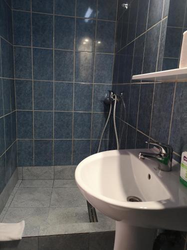 a bathroom with a sink and a toilet at Center Park Apartment in Cluj-Napoca