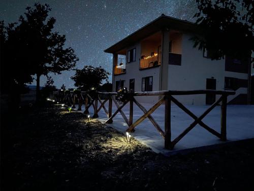 a house at night with lights in front of it at Il Rifugio Delle Stelle in Castelgrande