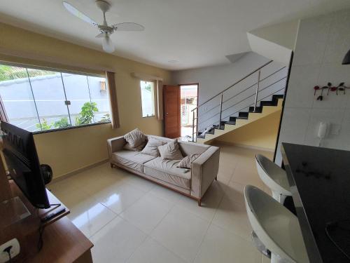Posezení v ubytování Casa Duplex Iriri - Banheira e Piscina