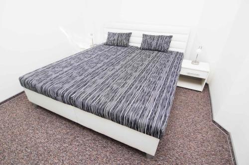 Кровать или кровати в номере Apartmany Anna Nicole