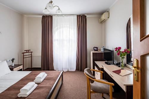 Ένα ή περισσότερα κρεβάτια σε δωμάτιο στο Hotel Galaktika