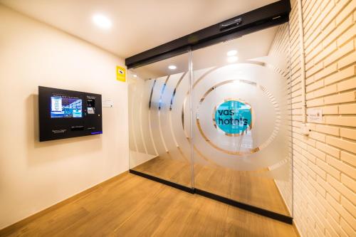 a room with a fan on the wall at Hotel Vas Vitoria AutoCheckIn in Vitoria-Gasteiz