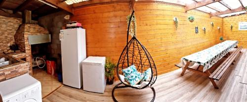 a room with a hammock in a kitchen at lilie97418 in La Plaine des Cafres