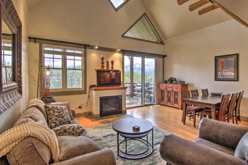 a living room with a couch and a fireplace at Steps to Moonlight Basin Scenic Mtn Retreat! in Big Sky