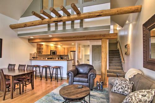 a living room with a couch and a table at Steps to Moonlight Basin Scenic Mtn Retreat! in Big Sky