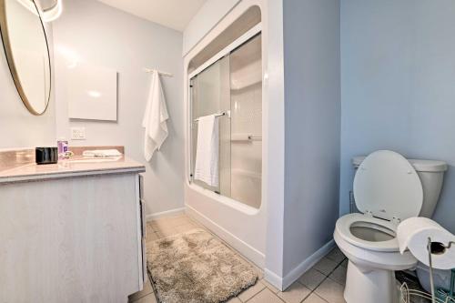 een badkamer met een toilet, een wastafel en een spiegel bij Lake Huron Home with Direct Beach Access! in De Tour Village