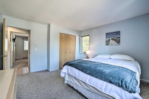 een slaapkamer met een groot bed en een tafel bij Lake Huron Home with Direct Beach Access! in De Tour Village
