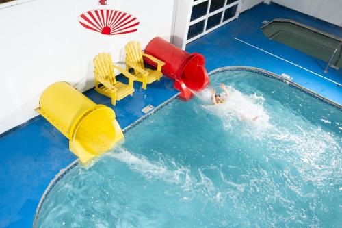 a water slide in a pool with a person in the water at The Resort at Governor's Crossing in Pigeon Forge