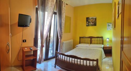 A bed or beds in a room at Complesso turistico Aurora - camere B&B