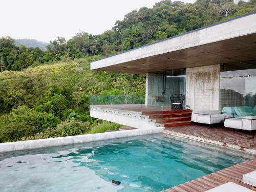 a house on a hill with a pool at Art Villas Costa Rica in Uvita