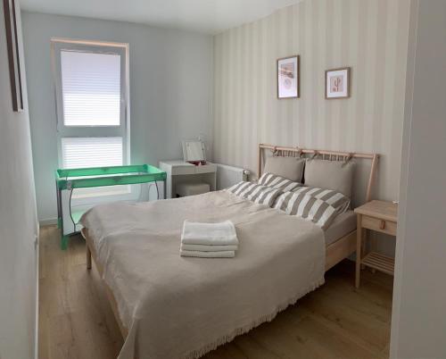 Posteľ alebo postele v izbe v ubytovaní Apartament Słoneczna Zatoka