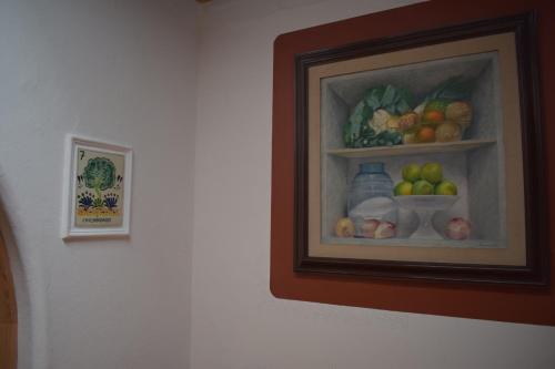a painting of fruits and vegetables on a wall at Sanbernabé tres in Guanajuato