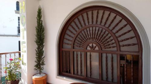 a large wooden window on a balcony at Hotel Lili - Popayán in Popayan