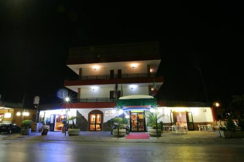 a building at night with lights in front of it at Hotel De Rosa in Boscoreale