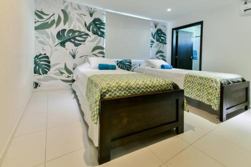 מיטה או מיטות בחדר ב-Tropical Breeze Apartamentos