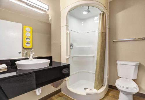 a bathroom with a toilet and a sink at Motel 6-Grants, NM in Grants