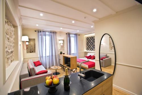 a kitchen and living room with a sink and a living room at Borelli Palace & Borelli Blue in Zadar