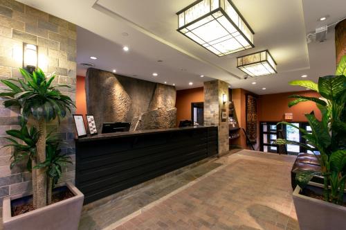 a lobby of a hotel with potted plants at Blackcomb Lodge in Whistler