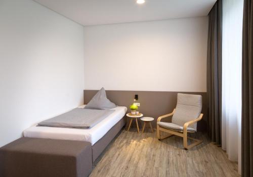 Postel nebo postele na pokoji v ubytování boardinghouse Main-Tauber