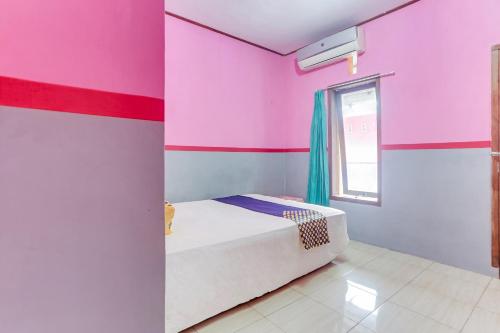 Кровать или кровати в номере Ijen Traveller & Homestay