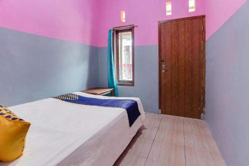 Кровать или кровати в номере Ijen Traveller & Homestay