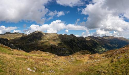 a view of a mountain range with clouds in the sky at Villa Michaela in Gerlos