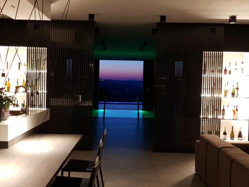 a restaurant with a table and chairs and a view at SUNSET SUITE SPA in Staffolo