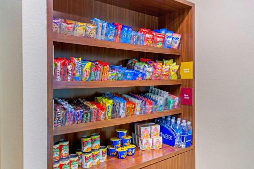 a shelf filled with lots of different drinks at Comfort Suites Little Rock West in Little Rock