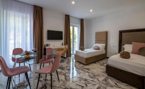 Postel nebo postele na pokoji v ubytování GRAND HOTEL SERAPIDE