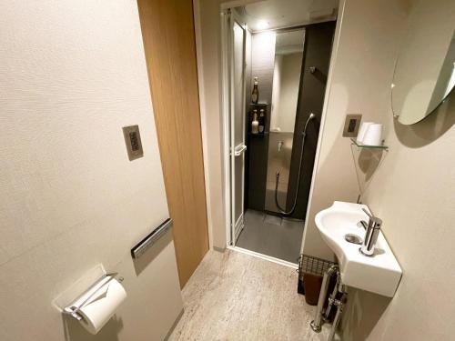 Ванная комната в Yumoto Station Hotel MIRAHAKONE
