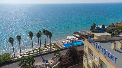 an aerial view of the ocean and a resort at Hotel President Sea Palace in Noto Marina