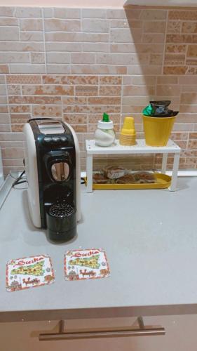 a pretend kitchen with a toaster on a counter at I VACANZIERI in Avola