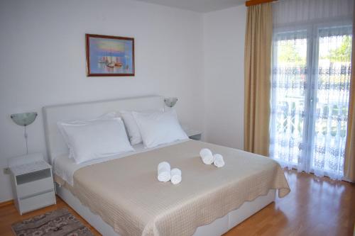 Postel nebo postele na pokoji v ubytování Villa Maria