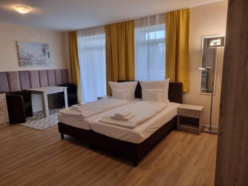 Ένα ή περισσότερα κρεβάτια σε δωμάτιο στο Apartments Oberschlesien