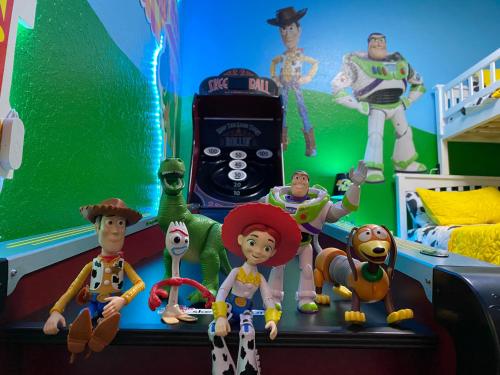 a group of toy figurines sitting on a desk at Magical Adventure Condo w Waterpark near Disney No Resort Fees in Orlando