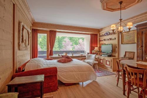 Giường trong phòng chung tại Apartment center Madonna di Campiglio AF