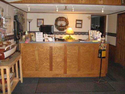 a kitchen with a counter and a counter top at White Caps Motel in Port Clinton