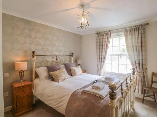 Voodi või voodid majutusasutuse Olde Carpenters Cottage toas