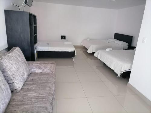 Katil atau katil-katil dalam bilik di Hotel Cayapo