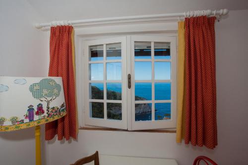 Photo de la galerie de l'établissement Calapiccola Luxury apartment with the view on Giglio and Giannutri islands, à Monte Argentario