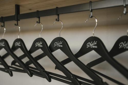 a rack of utensils hanging in a closet at St. Vigilius modern historic apartments in Nalles