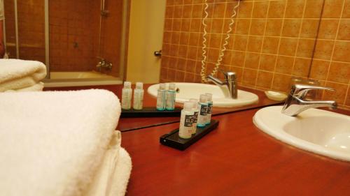 a bathroom with a sink and a toilet and a mirror at TALEN OTEL in Istanbul